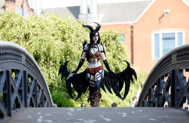 A cosplay competitor poses for a photograph outside the arena during the first Dota 2 Major in the UK – ESL One Birmingham 2018 at the Arena Birmingham, Britain on May 26, 2018. (Photo by Ed Sykes/Reuters/Action Image)
