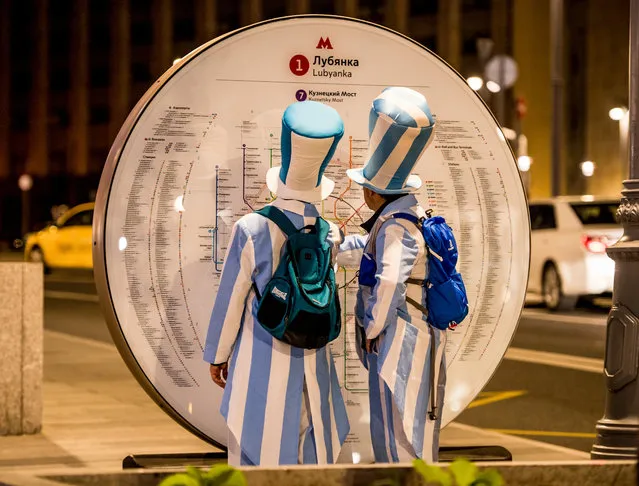 Argentina fans look at a metro map for directions in downtown Moscow on June 14, 2018, ahead of the Russia 2018 World Cup football tournament. (Photo by Mladen Antonov/AFP Photo)