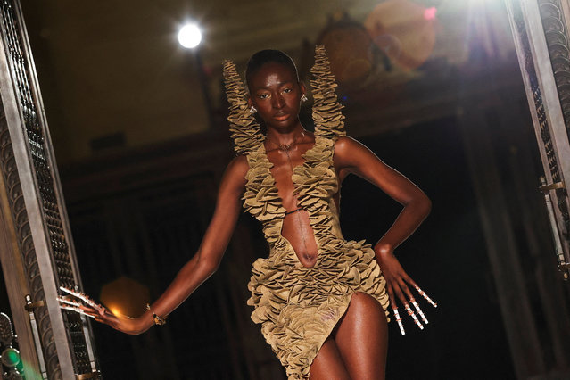 A model presents a creation at the Karina Bond SS26 catwalk show 'The Midnight Sun' as part of London Fashion Week, September 19, 2025. (Photo by Katie Collins/Reuters)