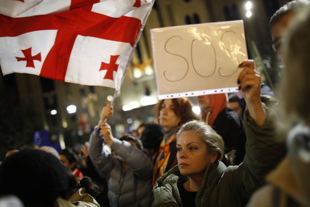 Supporters of opposition parties attend a protest in Tbilisi, Georgia, 28 October 2024, opposing the results of the parliamentary elections held on 26 October. Nearly 20 parties competed for seats in the country's highest legislative body, which comprises 150 deputies. The ruling Georgian Dream party, in power for 12 years, won with 54.3 percent of the vote. In response, several parties announced a boycott of the parliament, and the opposition Coalition for Changes declined both parliamentary mandates and state funding. (Photo by David Mdzinarishvili/EPA/EFE)