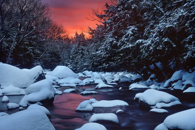 “Snowy River Sunrise”. I had scouted this scene previously. I knew a recent January thaw had cleared the stream, and fresh snow had fallen overnight. I hiked by headlamp in the dark, set up my tripod, and waited in the freezing cold darkness. I was rewarded with this. Location: Bartlett, White Mountains, New Hampshire, USA. (Photo and caption by Dana Clemons/National Geographic Traveler Photo Contest)