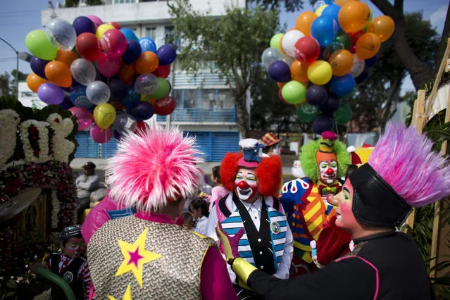Clowns gather for a procession toward the Basilica of Our Lady of Guadalupe in Mexico City, Monday, December 14, 2015. Hundreds of clowns belonging to various clown associations made their annual pilgrimage to the Basilica on Monday to pay their respects to the Virgin of Guadalupe, Mexico's patron saint. (Photo by Rebecca Blackwell/AP Photo)