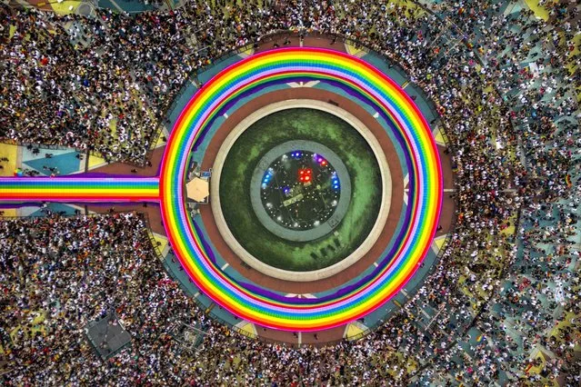 In an aerial view, Filipinos take part in the Pride Festival on June 24, 2023 in Quezon city, Metro Manila, Philippines. Twenty-three years after the first anti-discrimination bill based on sexual orientation and gender identity was introduced by lawmakers, the Philippines has yet to enact it into law. The SOGIE (Sexual Orientation or Gender Identity or Expression) Equality Bill is considered one of the slowest moving pieces of legislation in the country's history. (Photo by Ezra Acayan/Getty Images)