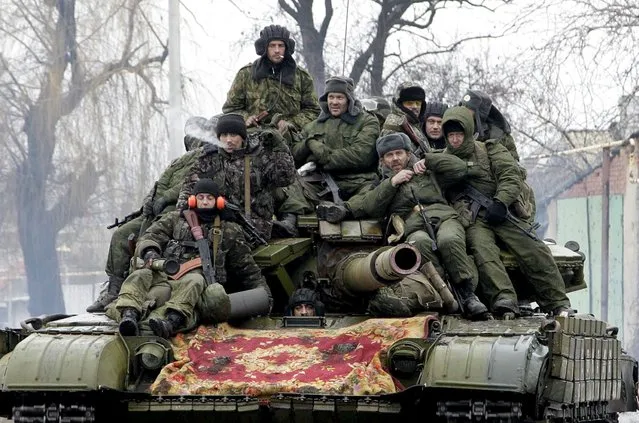 Members of the armed forces of the separatist self-proclaimed Donetsk People's Republic drive a tank on the outskirts of Donetsk, Ukraine, in this January 22, 2015 file photo. (Photo by Alexander Ermochenko/Reuters)