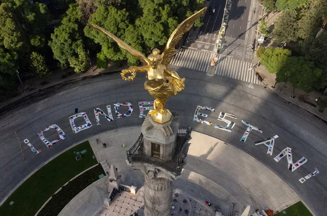 A message that reads “Where are they” in Spanish written with clothes of missing people, is seen on the roundabout of the Angel of Independence monument during the International Day of the Victims of Enforced Disappearances , in Mexico City, Mexico on August 30, 2022. According to the United Nations (UN) Committee on Enforced Disappearances, Public agents and organized crime are responsible for Mexico's soaring numbers of enforced disappearance. The Day was designated by the UN General Assembly in 2010. (Photo by Daniel Cardenas/Anadolu Agency via Getty Images)