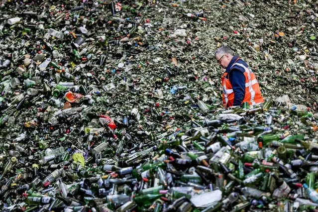 A mountain of bottles await processing at the glass recycling processing plant Van Tuijl, following the Christmas and New Year celebrations, in Gameren, Netherlands, 03 January 2017. (Photo by Remko De Waal/EPA)