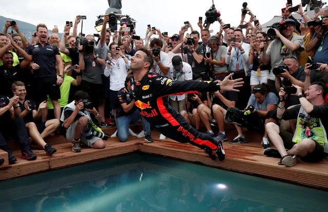 Red Bull's Daniel Ricciardo jumps into a pool as he celebrates winning the F1 Monaco Grand Prix in Monte Carlo, May 27, 2018. (Photo by Benoit Tessier/Reuters)