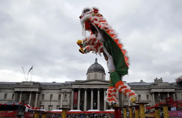 Performers wear a traditional costume to perform the “Flying Lion Dance” at an event to celebrate Chinese New Year in London, Britain February 14, 2016. (Photo by Neil Hall/Reuters)
