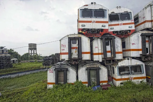More than 100 trains have been left to rot in the “graveyard”, on February 27, 2015, in Purwakarta, Indonesia. (Photo by HKV/Barcroft Media)