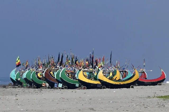 Fishing boats are seen along a beach in Teknaf on November 24, 2023. (Photo by Munir Uz Zaman/AFP Photo)