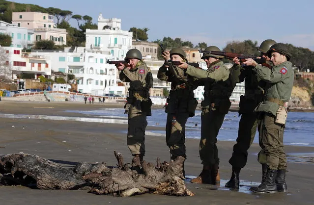 Volunteers wearing the uniform of the U.S. army pose as they participate in the re-enactment of a World War Two landing to mark its 70th anniversary in Anzio, near Rome, January 25, 2014. (Photo by Stefano Rellandini/Reuters)