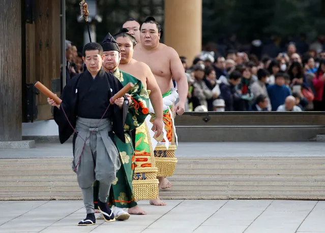 Mongolian-born grand sumo champion Yokozuna Harumafuji (R) arrives for performing the New Year's ring-entering rite at the annual celebration for the New Year at Meiji Shrine in Tokyo, Japan, January 6, 2017. (Photo by Issei Kato/Reuters)