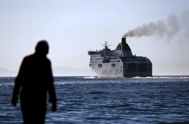A man looks at a ferry departing from the western Greek town of Patras May 4, 2015. (Photo by Yannis Behrakis/Reuters)