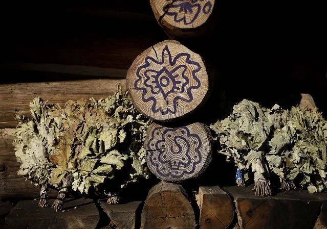 Dried herbs sit in the sun outside a steam sauna. (Photo by Jae C. Hong/Associated Press)
