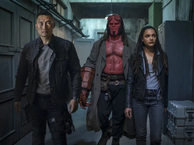 This image released by Lionsgate shows, from left, Daniel Dae Kim, David Harbour and Sasha Lane in a scene from “Hellboy”. (Photo by Mark Rogers/Lionsgate via AP Photo)