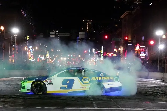 Chase Elliott does a burnout during the Burnouts on Broadway competition as part of NASCAR Champion's Week, Wednesday, December 1, 2021, in Nashville, Tenn. (Photo by Mark Humphrey/AP Photo)