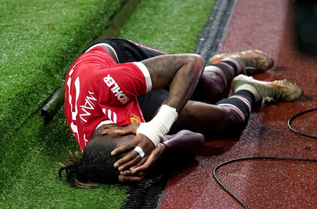 Manchester United's Aaron Wan-Bissaka lies injured on the floor during the UEFA Champions League, Group F match at Old Trafford, Manchester on Wednesday, December 8, 2021. (Photo by Martin Rickett/PA Images via Getty Images)