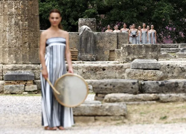 Performers acting as Priestess during the flame lighting ceremony for the Paris 2024 Olympics in Ancient Olympia, Greece, on April 16, 2024. (Photo by Alkis Konstantinidis/Reuters)