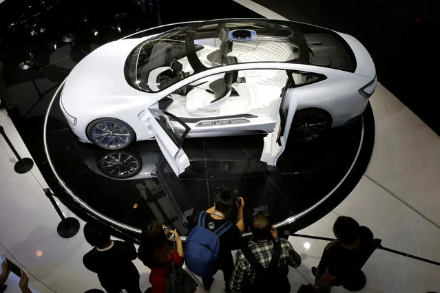 Visitors look at all-electric battery concept car called LeSEE during Auto China 2016 auto show in Beijing, April 25, 2016. (Photo by Kim Kyung-Hoon/Reuters)