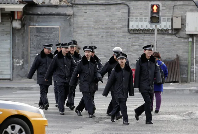 Security personnel walk through a crossing near Tiananmen Square in central Beijing, China, March 1, 2017. (Photo by Jason Lee/Reuters)
