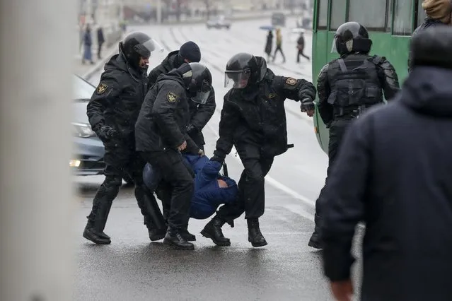 Belarus police detain an activist during an opposition rally in Minsk, Belarus, Saturday, March 25, 2017. (Photo by Sergei Grits/AP Photo)