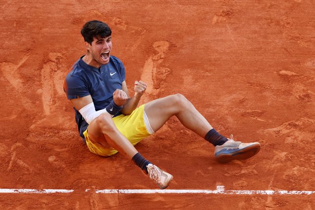 Carlos Alcaraz of Spain celebrates winning match point against Alexander Zverev of Germany during the Men's Singles Final match on Day 15 of the 2024 French Open at Roland Garros on June 09, 2024 in Paris, France. (Photo by Clive Brunskill/Getty Images)