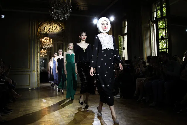 Models wear creations for Ulyana Sergeenko's fall-winter 2015/2016 Haute Couture fashion collection presented in Paris, France, Sunday, July 5, 2015. (Photo by Thibault Camus/AP Photo)