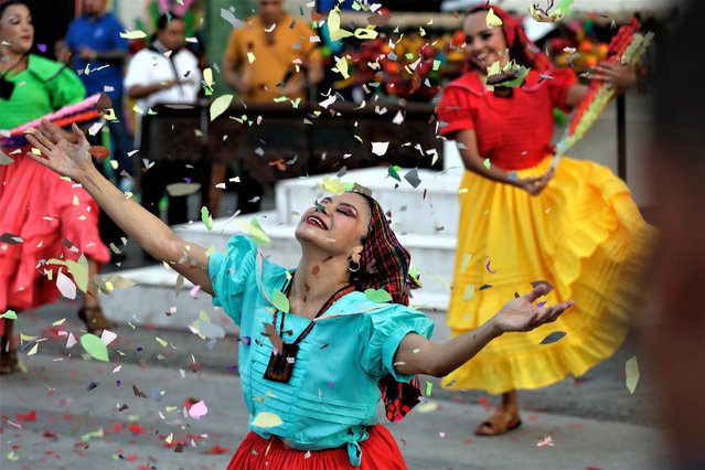 Members of the National Folkloric Ballet perform different traditional dances during the celebration of the 106th anniversary of the National Theater, in the historic center of San Salvador, El Salvador, 01 March 2023. The theater has presented countless artistic presentations such as dance, theater and concerts since it opened its doors in 1917. (Photo by Rodrigo Sura/EPA/EFE)