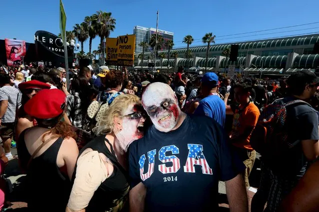 Sharon McLachlan and Richard DeWalt show their zombie costumes in The Gaslamp Quarter at the 2015 Comic-Con International in San Diego, California July 10, 2015. (Photo by Sandy Huffaker/Reuters)