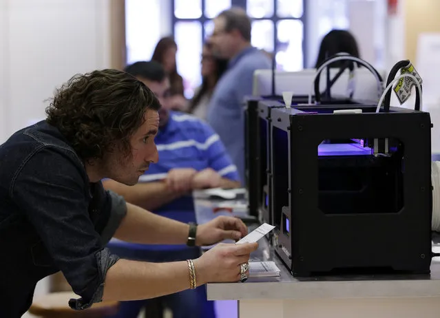 MakerBot Replicator 2 desktop 3D printers are calibrated at the GE Garage in Washington March 20, 2014. GE Garage space is open from March 24 to April 9 in Washington and offers the chance to explore and learn about how technology is changing the way things are built today. (Photo by Gary Cameron/Reuters)