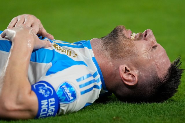 Argentina's Lionel Messi grimaces in pain during the Copa America final soccer match against Colombia in Miami Gardens, Fla., Sunday, July 14, 2024. (Photo by Rebecca Blackwell/AP Photo)