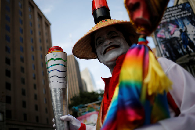 A reveller takes part in the annual Gay Pride parade along Paulista Avenue in Sao Paulo, Brazil, May 29, 2016. (Photo by Nacho Doce/Reuters)