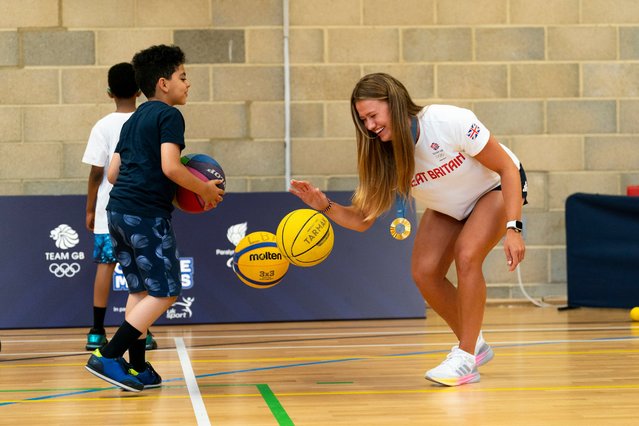 Lola Anderson plays basketball with children during the photocall at North Paddington Youth Club, London on Tuesday, August 13, 2024. Fresh from inspiring the nation in Paris, Team GB's stars are getting immediately involved in making a real difference in communities giving back at a Youth Club that uses sport and physical activity as a vehicle to educate young people and give them a safe space to learn and develop. (Photo by Jordan Pettitt/PA Images via Getty Images)