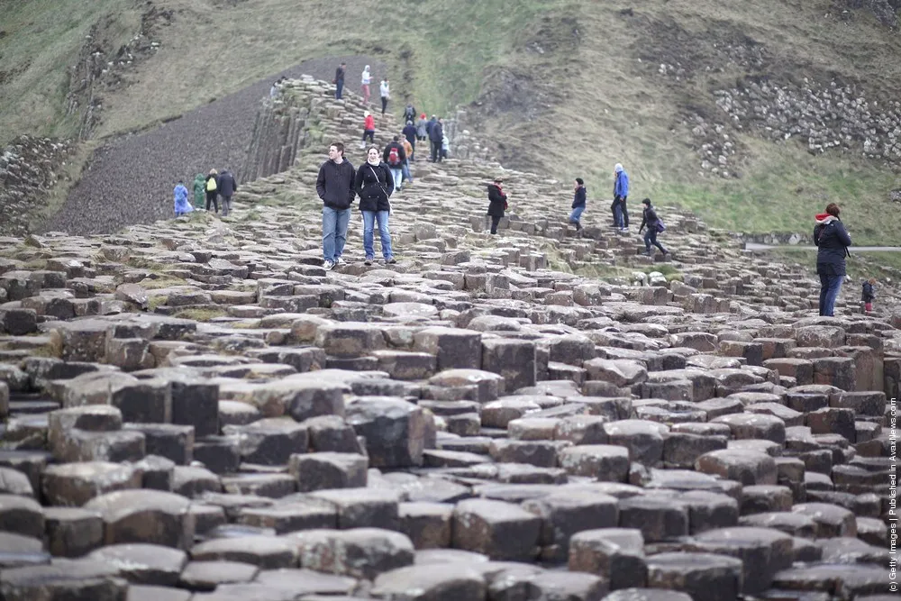 Visitors Enjoy the Ancient Basalt Columns that form the Giants Causeway