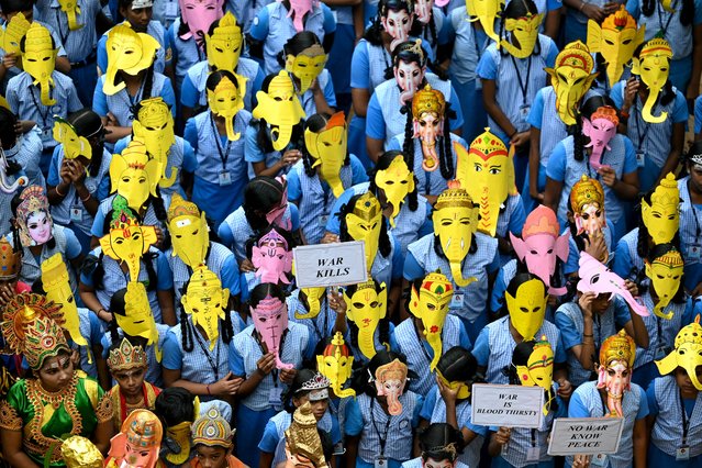 Children wear masks in the guise of Hindu deity Ganesha, at a school in Chennai on September 6, 2024, on the eve of Ganesh Chaturthi festival. (Photo by R.Satish Babu/AFP Photo)