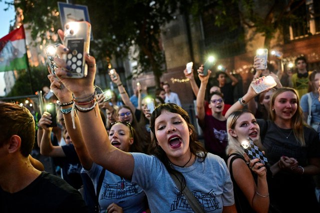 People take part in a demonstration after the head of a leading public high school was dismissed for disagreeing with a new government policy about banning students from using mobile phones in schools, in Budapest, Hungary on September 2, 2024. (Photo by Marton Monus/Reuters)