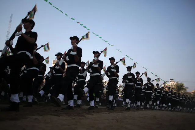 Young Palestinians march during a graduation ceremony of the Hamas, Liberation Youth, military summer camp, in Gaza City, Wednesday, August 5, 2015. (Photo by Khalil HamraAP Photo)