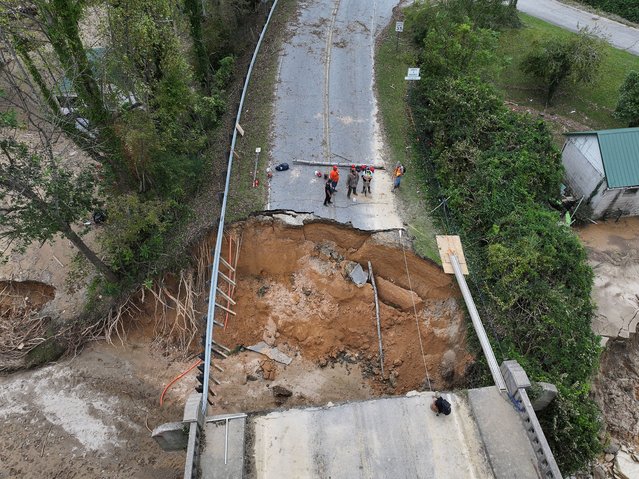 A drone view shows damage to U.S. Route 64, following the passing of Hurricane Helene, Bat Cave, North Carolina, U.S., September 30, 2024. (Photo by Marco Bello/Reuters)