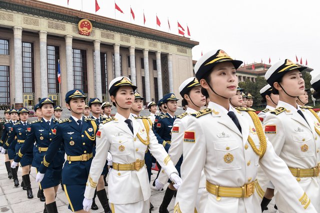 Military honour guards prepare for a welcome ceremony with French President Emmanuel Macron and Chinese President Xi Jinping at the Great Hall of the People in Beijing on November 6, 2019. (Photo by Nicolas Asfouri/AFP Photo)