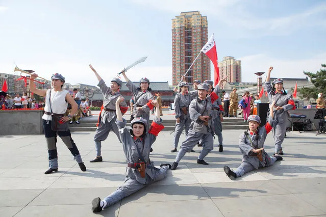 People perform a dance wearing army uniforms for the upcoming 95th anniversary of the foundation of Communist Party of China, in Changchun, Jilin Province, China June 16, 2016. (Photo by Reuters/Stringer)