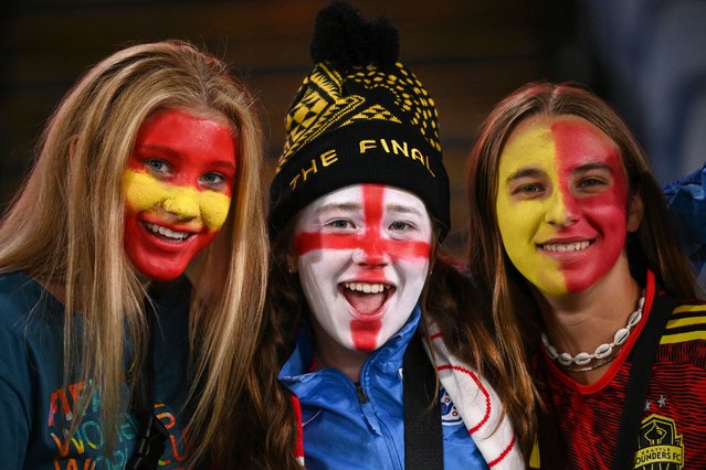 Fans pose ahead of the Australia and New Zealand 2023 Women's World Cup final football match between Spain and England at Stadium Australia in Sydney on August 20, 2023. (Photo by Franck Fife/AFP Photo)