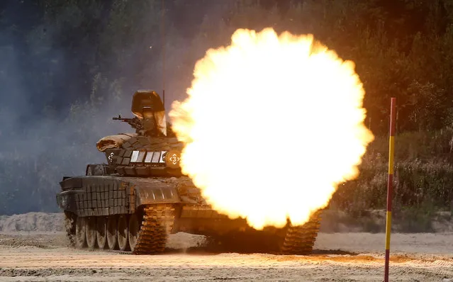 A T-72B1 tank fires during the Safe Route competition at the International Army Games 2017 at the Andreyevsky military polygon outside Tyumen, Russia, August 6, 2017. (Photo by Maxim Shemetov/Reuters)