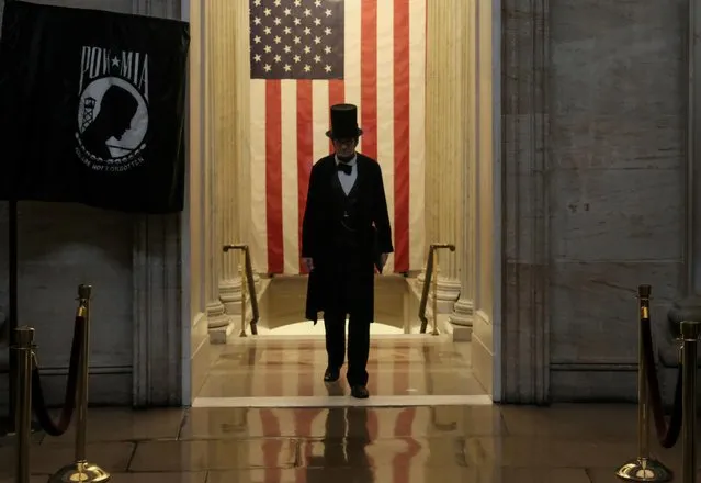 A man dressed as Abraham Lincoln walks into the U.S. Capitol Rotunda during a rally calling for the removal of U.S. President Donald Trump on Capitol Hill in Washington, U.S., February 5, 2020. (Photo by Michael A. McCoy/Reuters)