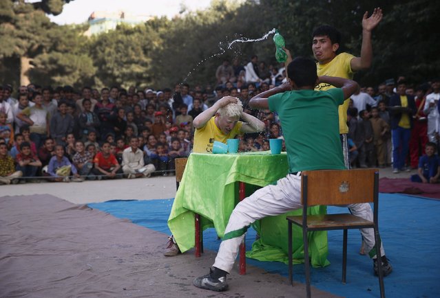Boys who are part of Afghan Mobile Mini Circus for Children (MMCC) act in a play during MMCC's festival in Kabul, Afghanistan August 14, 2015. (Photo by Ahmad Masood/Reuters)