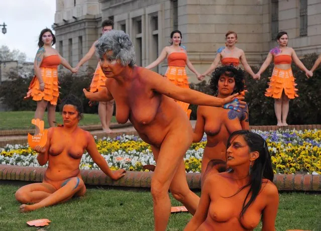 Women with body paintings take part in a demo in favour of the legalization of abortion in front of the Congress building in Montevideo on September 25, 2012. The Congress is voting a law project which would decriminilize the interruption of pregnancy under certain conditions, including obliging women to set out before a tribunal the reasons for the abortion.  AFP PHOTO/Miguel ROJO        (Photo credit should read MIGUEL ROJO/AFP/GettyImages)