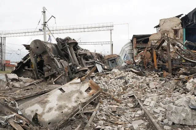 Debris of a railway depot ruined after a Russian rocket attack in Kharkiv, Ukraine, Wednesday, September 28, 2022. (Photo by Andrii Marienko/AP Photo)