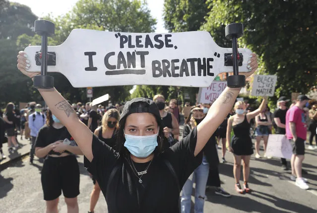 People protest under the slogan Black Lives Matter, and I Can't Breathe, rally outside the US Embassy in Dublin, Ireland, Monday June 1, 2020, following the death of George Floyd.  The recent killing of George Floyd in Minneapolis, USA, has led to protests in many countries, and across the U.S. (Photo by Niall Carson/PA Wire via AP Photo)