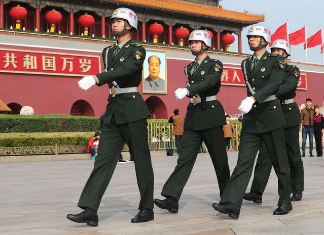 Chinese paramilitary policemen patrol the Tian'anmen Square ahead of the 19th National Congress of the Communist Party of China (CPC) on October 16, 2017. (Photo by Imaginechina/Rex Features/Shutterstock)