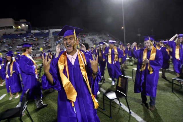 Wylie High School senior Christian Merced expresses his feelings after  graduation was halted midway through because of an incoming thunderstorm Friday, June 19, 2020. (Photo by Ronald W. Erdrich/The Abilene Reporter-News via AP Photo)
