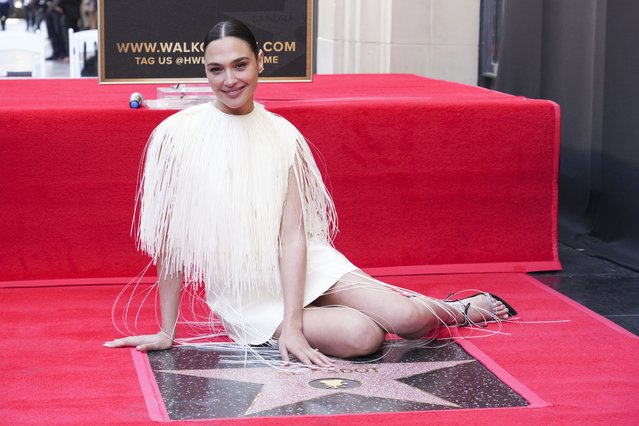 Israeli actress Gal Gadot poses with her new star at a ceremony honoring her on the Hollywood Walk of Fame on Tuesday, March 18, 2025, in Los Angeles. (Photo by Jordan Strauss/Invision/AP Photo)